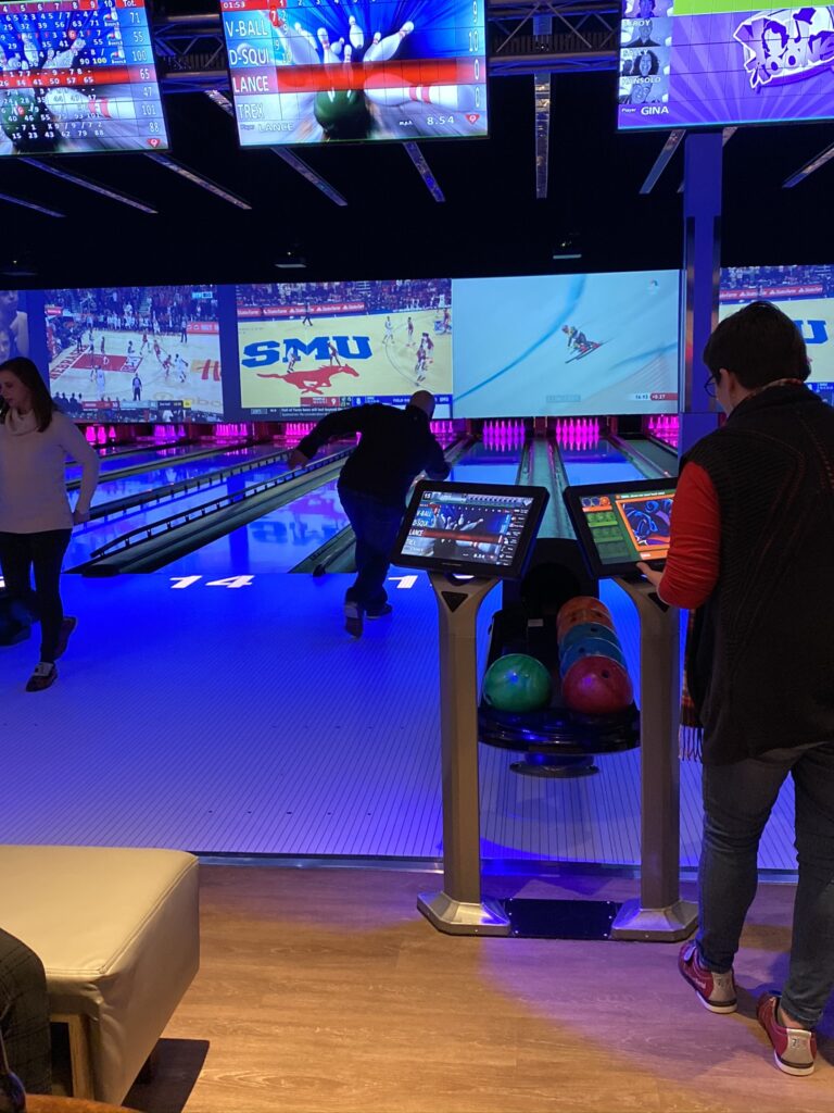 Person bowling at Team BQMI Holiday Gathering